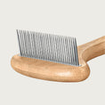 Load image into Gallery viewer, Close-up of the metal comb section of the rake. Tines are evenly spaced and one length.