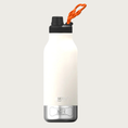 Load image into Gallery viewer, A white insulated water bottle with a black lid & drinking spout and a small, hollow, orange, paw print shaped flip-up handle. The base is a small stainless steel bowl that screws into the bottle, with the outline of a dog bone with the word 'WATER' in its center. The steel bowl is flush with the sides of the water bottle - no part of it sticks out.