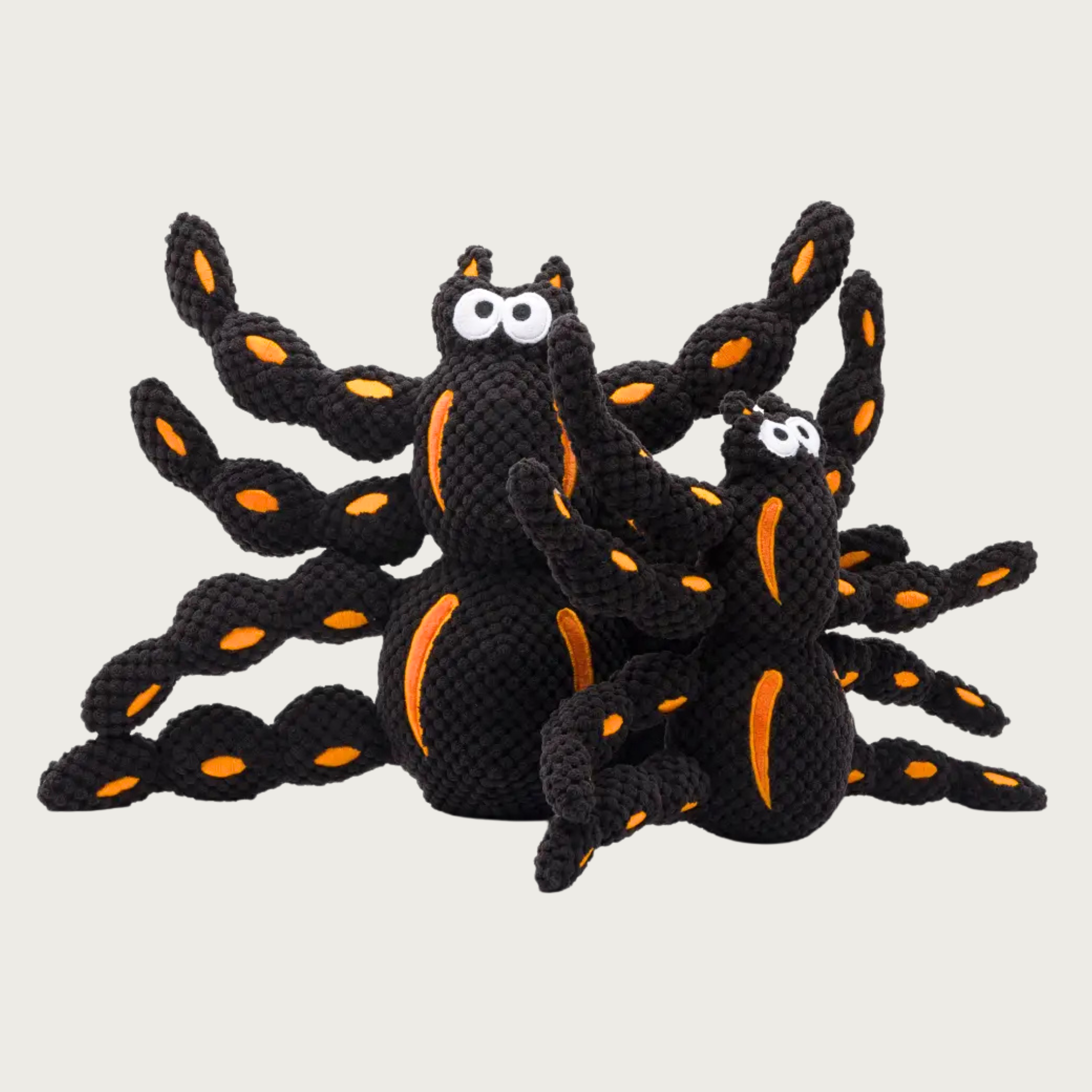 Two Floppy Spider dog toys side by size, to show size difference between the small & large toys.