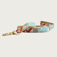 Load image into Gallery viewer, Dog leash with light blue base color, and criss-cross plaid pattern in cream and burnt orange.