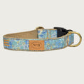 Load image into Gallery viewer, Dog collar featuring a subtle floral pattern in shades of pastel blue. Black plastic buckle and brass D-ring.