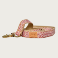 Load image into Gallery viewer, Matching leash to the Loulou Collar. It has a tiny, dense floral pattern in shades of pink. Underside is a light tan cotton. Features brass claw-style clip.