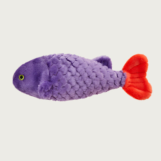 Plush Cici the Tropical Fish dog toy from Fluff & Tuff. Toy has a purple body with textured scale details, a red tailfin, and yellow eyes.