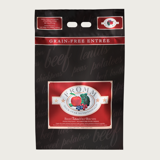 A 12 pound black and red bag of Fromm Beef Frittata Veg Recipe dog food. The banner on top of the bag reads "Grain-Free Entree".