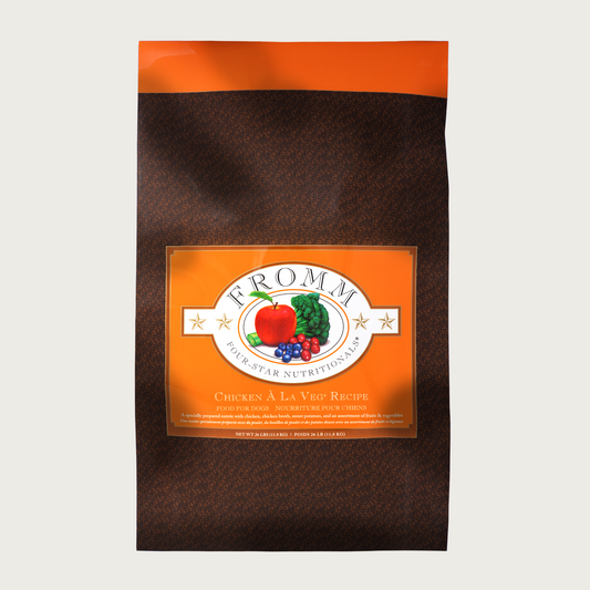 A 26 pound black and orange bag of Fromm Chicken a la Veg Recipe dog food.