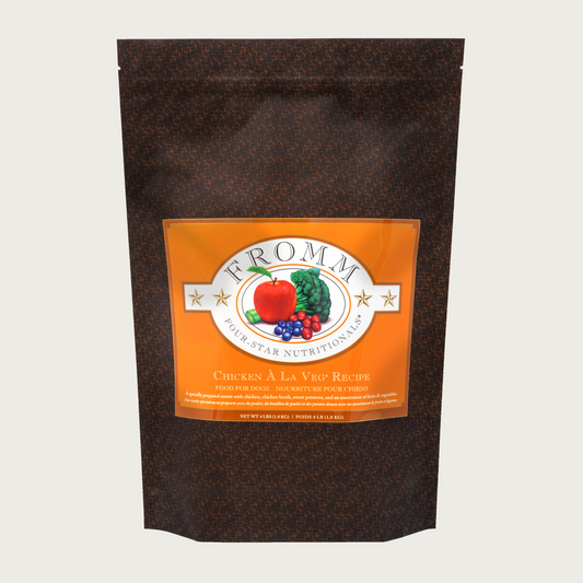 A 4 pound black and orange bag of Fromm Chicken a la Veg Recipe dog food.