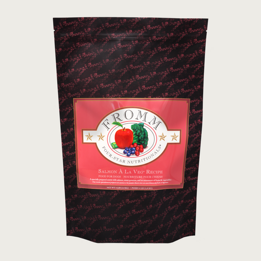 A 4 pound black and coral bag of Fromm Salmon A La Veg Recipe dog food.