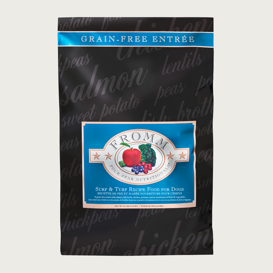 A 26 pound black and blue bag of Fromm Surf & Turf Recipe dog food. The banner on top of the bag reads "Grain-Free Entree".