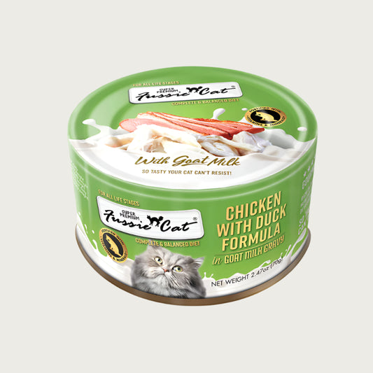 A 2.47 oz lime green can of Fussie Cat Chicken with Duck Formula in Goat Milk Gravy cat food. Super premium, for all life stages - "so tasty your cat can't resist!" Image on top of can shows flaked and shredded chicken and duck.