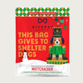 Load image into Gallery viewer, 6 oz Christmas-themed bag of Muttcracker (peanut butter, banana, & carob) dog treats by GivePet. Soft-baked, premium dog treats. Large text on front reads "This Bag Gives to Shelter Dogs".