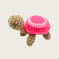 Load image into Gallery viewer, Crocheted Lil' Turtle cat toy with a tan body and a bright pink shell featuring a white circle and embroidered eyes & mouth.