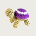 Load image into Gallery viewer, Crocheted Lil' Turtle cat toy with a tan body and a purple shell featuring a white circle and embroidered eyes & mouth.