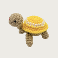 Load image into Gallery viewer, Crocheted Lil' Turtle cat toy with a tan body and a bright yellow shell featuring a white circle and embroidered eyes & mouth.