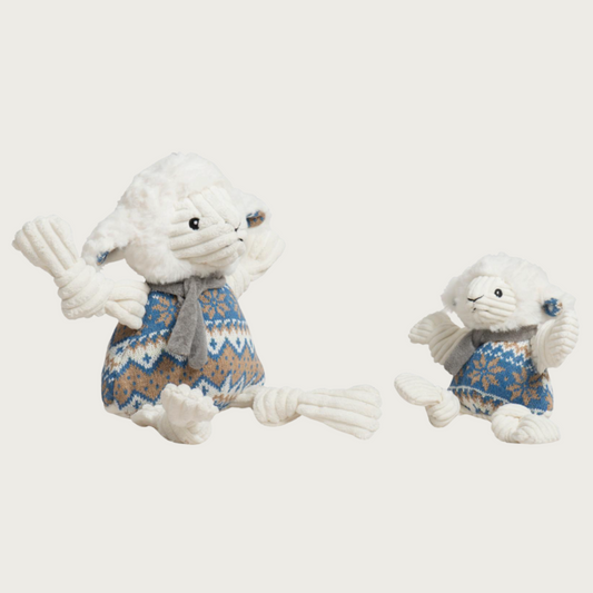 Small and large Leo Lamb dog toys sitting side by side to show size difference.