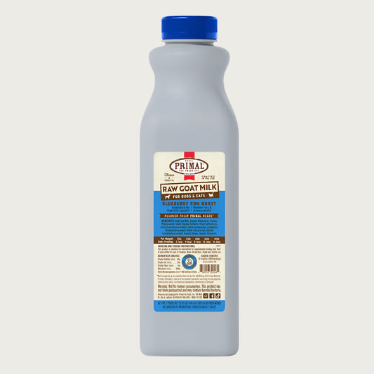 A 32 ounce plastic bottle of frozen Primal raw goat milk blueberry pomegranate recipe for dogs and cats of all life stages, with probiotics for digestive support.