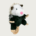 Load image into Gallery viewer, Side view of shaggy plush possum dog toy from Tall Tails. This realistic looking toy has a black plush body with white head, embroidered eyes, pink nose, brown ears and curly beige tail. Its back has two tones of shaggy gray faux fur.
