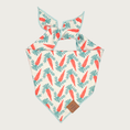 Load image into Gallery viewer, Easter-themed dog bandana. Base color is cream with carrots and their greenery strung across like rows of Christmas lights. The repeating pattern features muted tones of orange and green.