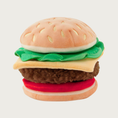 Load image into Gallery viewer, Plush dog toy designed to resemble a cheeseburger, with individual layers of a top & bottom bun, lettuce leaf, cheese slice, beef patty, and tomato slice.