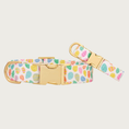 Load image into Gallery viewer, Two Easter Eggs dog collars with different widths (5/8" and 1"), with the smaller & more narrow collar leaning on the larger one.