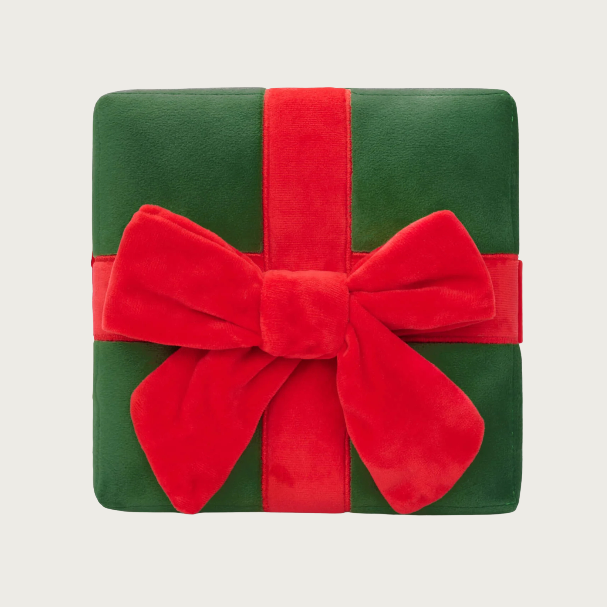 Plush, Christmas themed dog toy in the shape of a dark green gift box with a red ribbon.