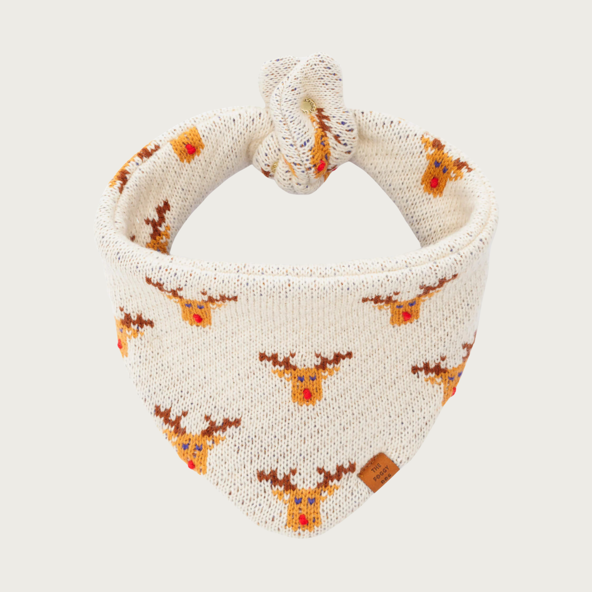 Christmas-themed, cream colored sweater knit dog bandana with a repeating Rudolph the Red-Nosed Reindeer pattern.