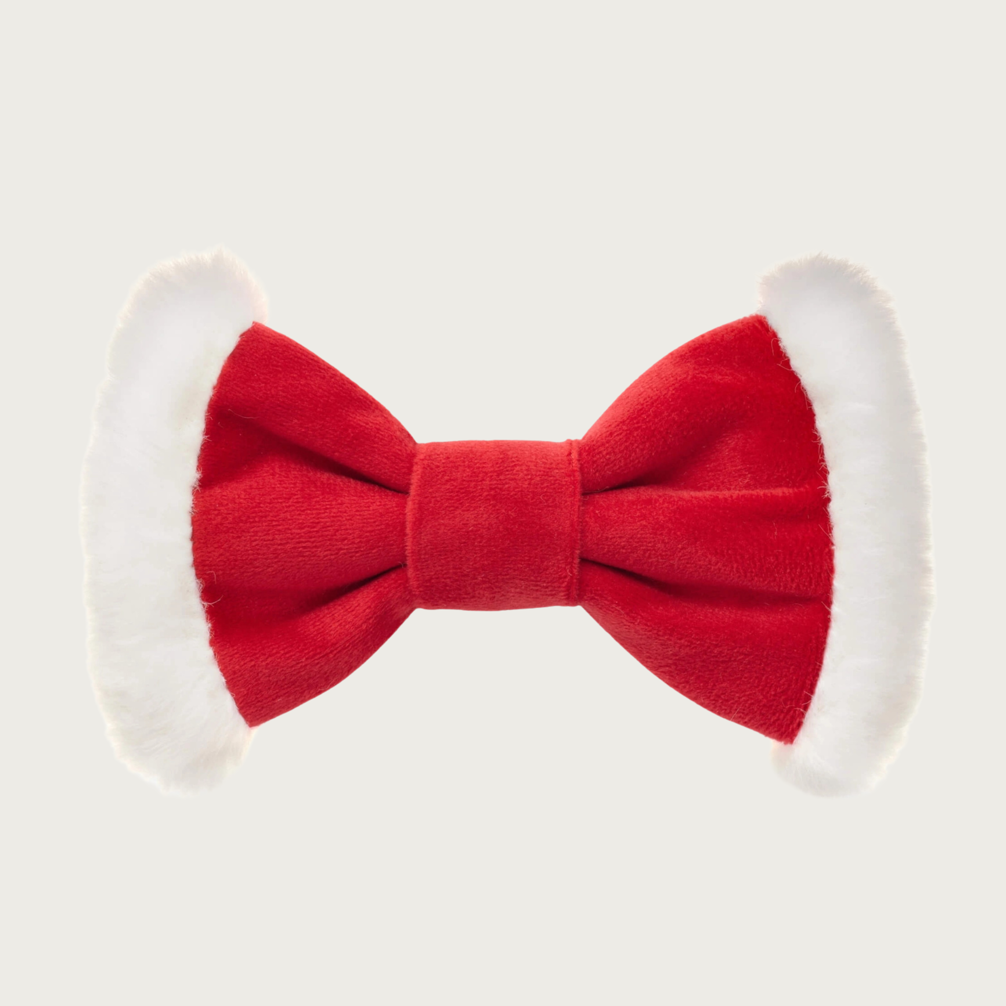 Christmas-themed, red velvet and white plush dog bow tie by The Foggy Dog. Body of the tie is red, with each end accented with the white plush fabric.