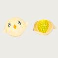 Load image into Gallery viewer, Small, pale yellow chick toy that has been opened up to show the yellow, spiky rubber ball inside it. This toy is what's inside the larger chicken.