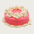 Load image into Gallery viewer, Bright pink iced dog cake with white decorative frosting and pastel pink round non-pareils.