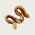 Load image into Gallery viewer, Tan-brown dog chew shaped like a tightly condensed squiggle. The shape is reminiscent of hard ribbon candy.