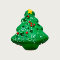 Load image into Gallery viewer, Green Christmas tree-shaped dog cookie with red, green, and white sprinkles and a frosting gold star.