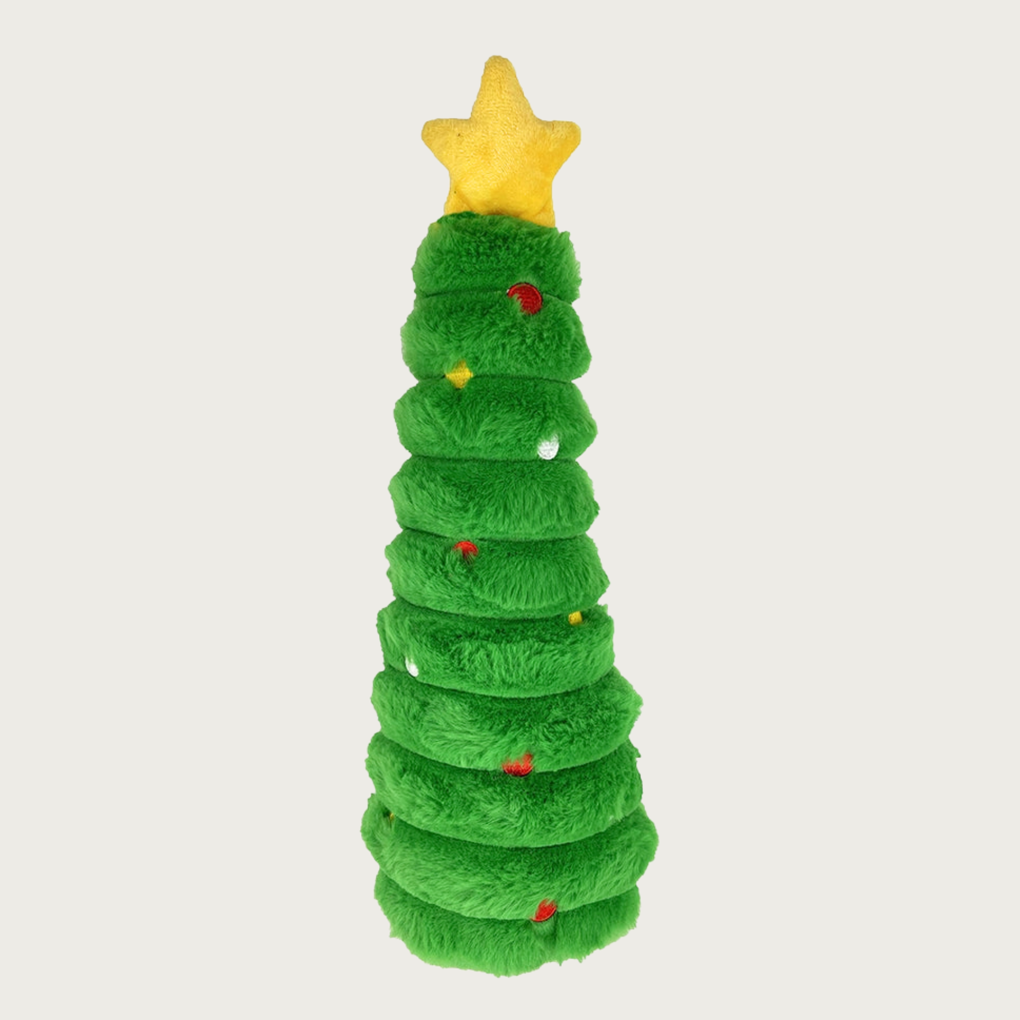 Green, cone-shaped, textured plush Christmas tree dog toy with embroidered red, yellow and white dots, and a yellow star on top.