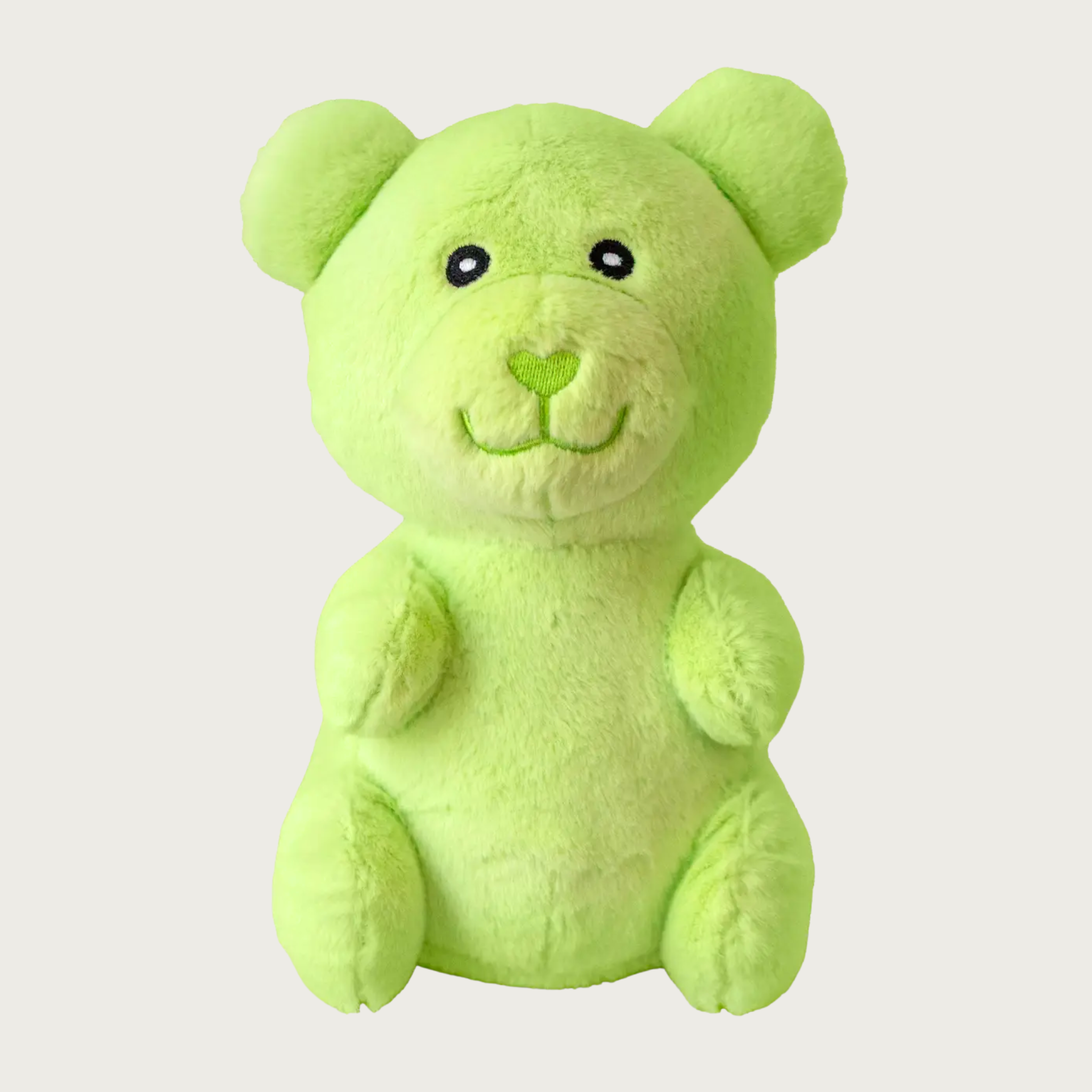 Plush, light lime green dog toy that looks like a gummy bear.