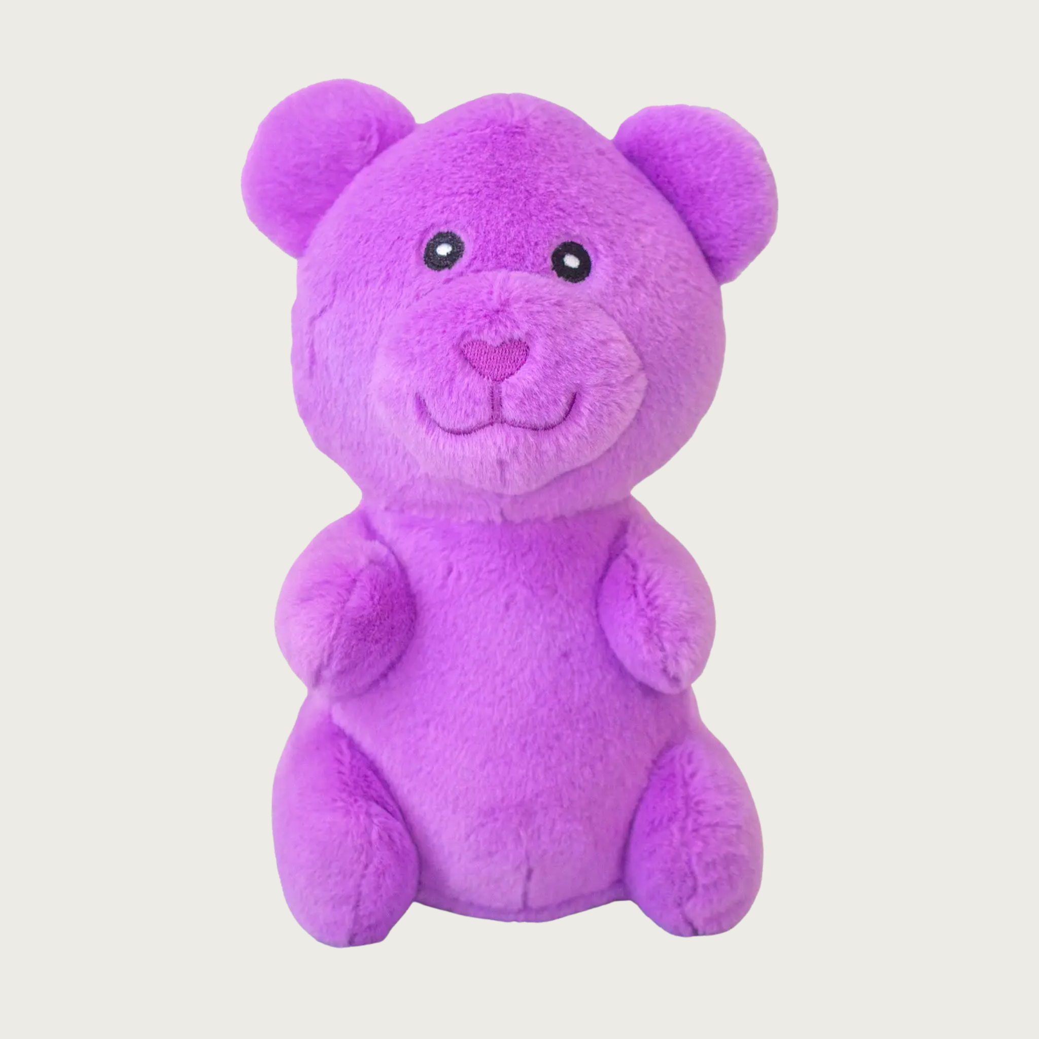 Plush, purple dog toy that looks like a gummy bear.