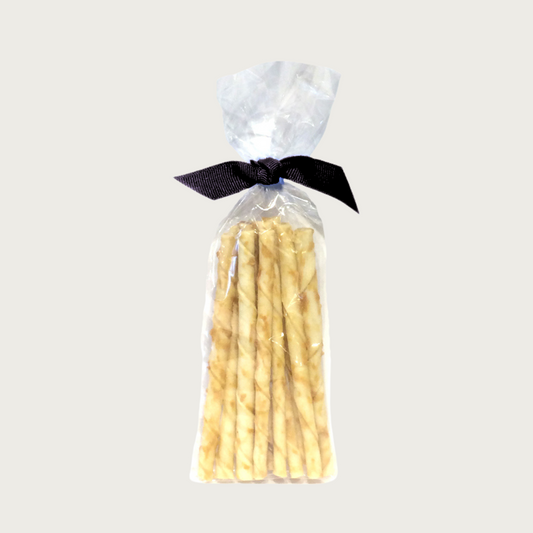 Clear, cellophane package of 10 No-Hide Stix, tied with black ribbon. All flavors look similar. Sticks are tan colored, and shaped like short, twisted sticks.