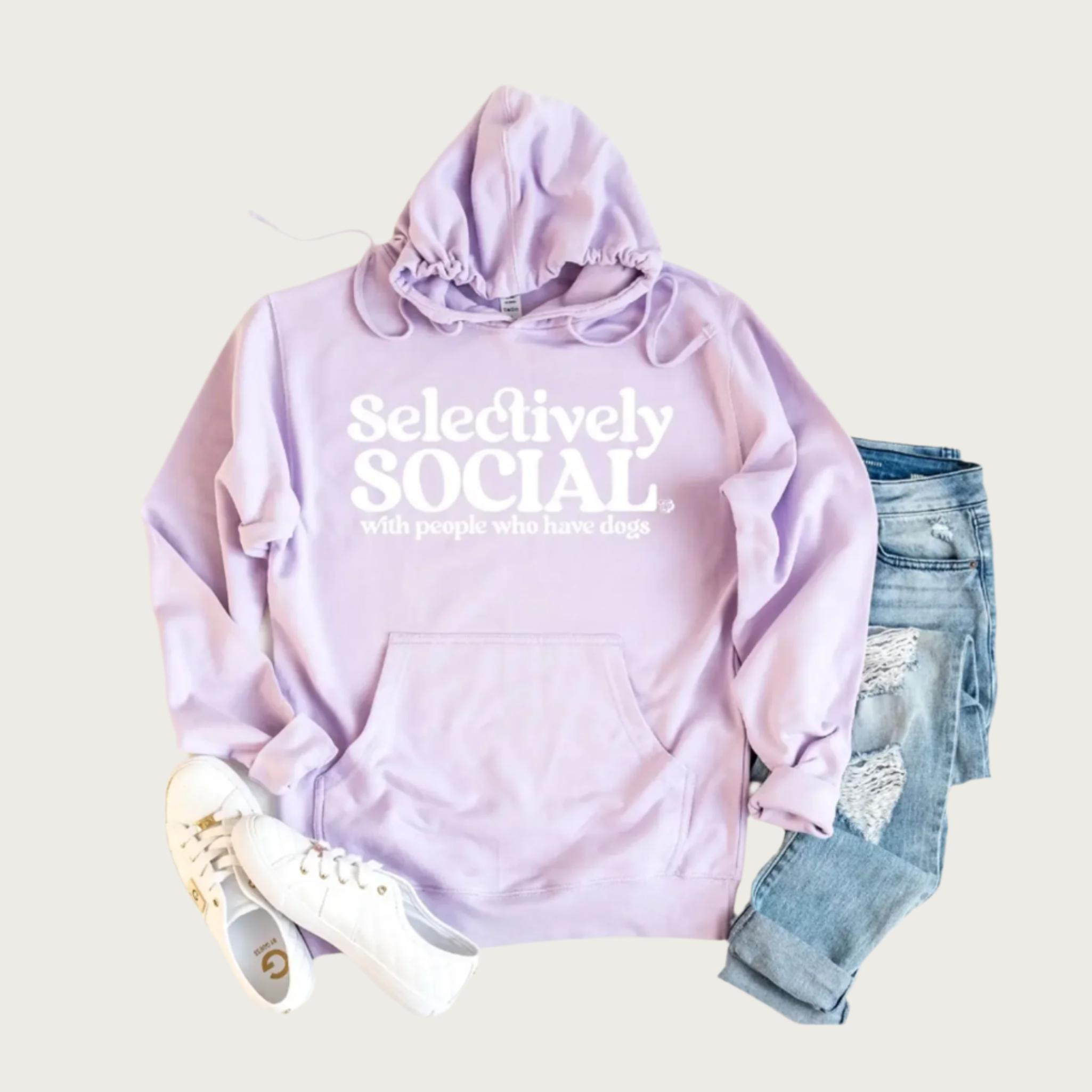 Long sleeved hooded sweatshirt with hood drawstrings and a pocket, in a light purple/lilac color. White text on chest reads "Selectively Social" in a playful font in large type; beneath that in smaller type reads "with people who have dogs".
