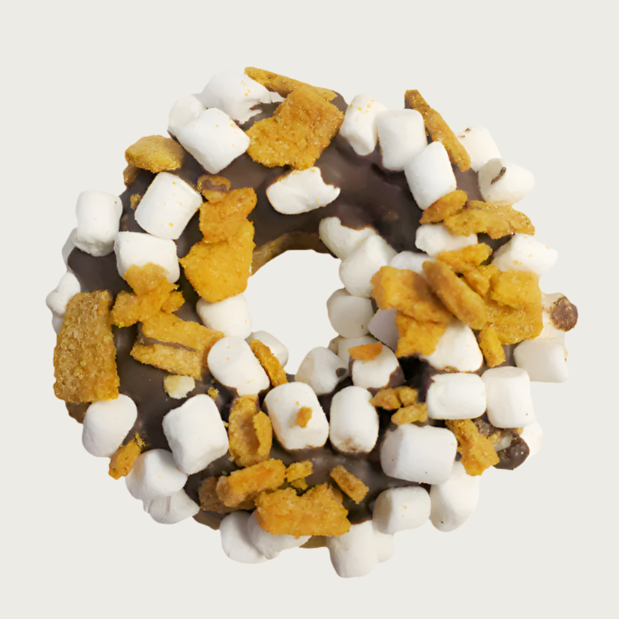 Thick, donut-shaped dog cookie dipped in carob and decorated with mini marshmallows and graham cracker bits.