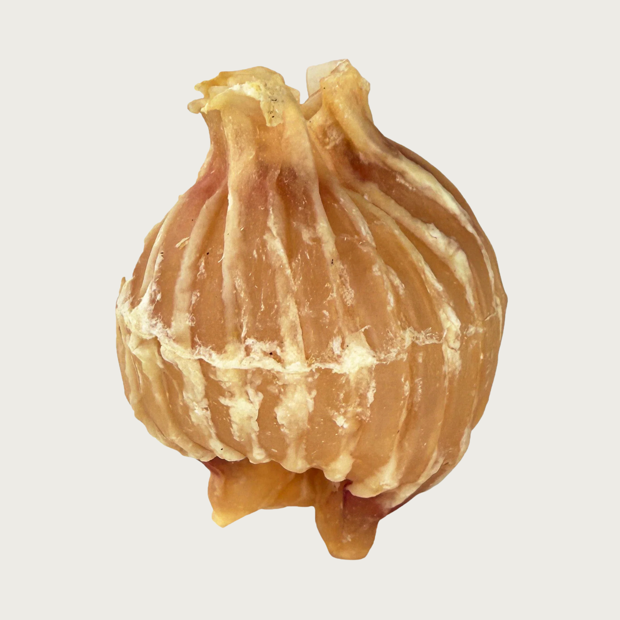 Round Trachea Ball dog chew that is tan in color. Shape resembles a whole onion.