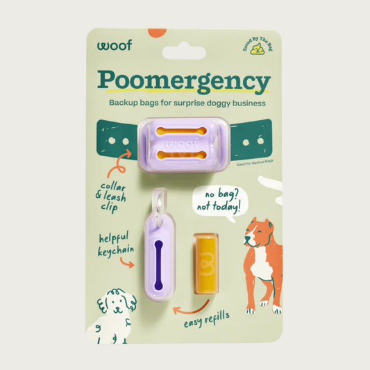 Poomergency-Lavender product in packaging. There is a light purple collar & leash clip with 2 slit openings, helpful keychain with 1 slit opening, and an example tightly rolled poop bag.