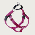 Load image into Gallery viewer, Dog harness with raspberry pink nylon straps on the front and sides; loop on dog's back is black. Chest strap is raspberry pink velvet. There are 2 black plastic clips, which fasten behind each front leg.