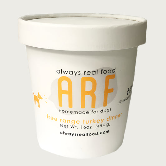 16 oz white carton with lid, of Always Real Food (ARF) Homemade for Dogs, free range turkey dinner.