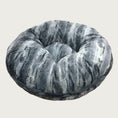 Load image into Gallery viewer, Round, plush pet bed made with faux fur in shades of black, gray and cream in a subtle striped pattern.