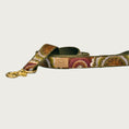 Load image into Gallery viewer, Dog leash with circular, geometric pattern in shades of olive green, burgundy, orange, brown and cream.