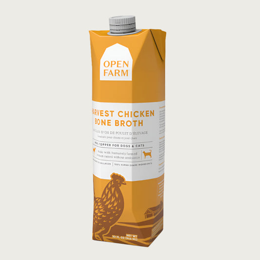 A 32 oz yellow & white carton with spout, of Open Farm Harvest Chicken Bone Broth Meal Topper for Dogs & Cats.