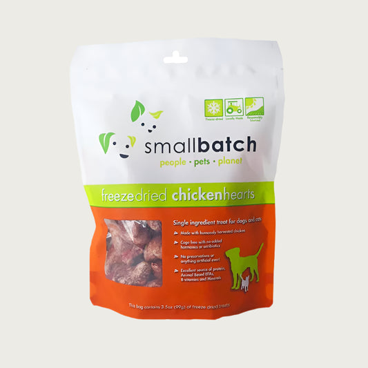 An orange and white bag of Smallbatch freeze-dried raw chicken heart treats for dogs and cats, 3.5 ounces. This is a single ingredient treat. The bag has a small, clear window showing the whole organ treats, which are about 2-3 inches long.