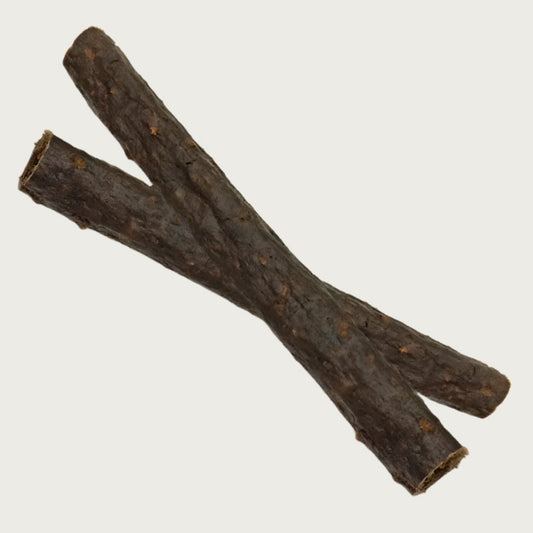 Two elk crunchy dog chews stacked like an X. They are dark brown, and about 1-1.5" thick.