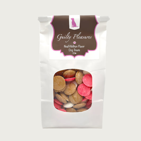 1.5 lb white craft paper bag of Wet Nose Guilty Pleasures NeaPAWlitan Flavor Dog Treats. Clear window on bag shows tan, cream, and pink disc-shaped treats inside.