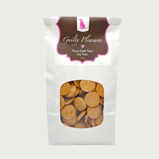 1.5 lb white craft paper bag of Wet Nose Guilty Pleasures Peanut Butter Flavor Dog Treats. Clear window on bag shows tan, disc-shaped treats inside.