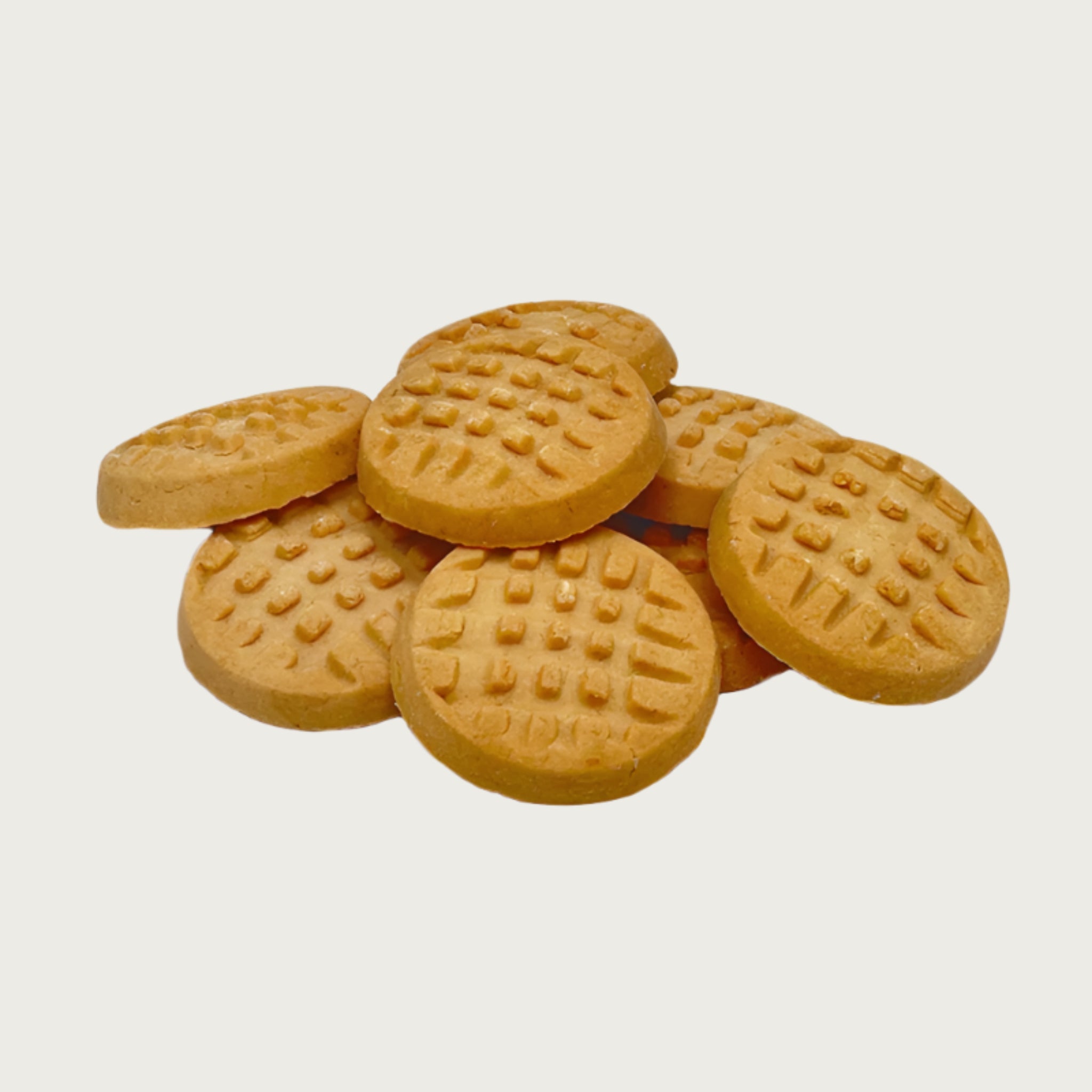 Closeup photo of a stack of Wet Nose Woof! Waffles peanut butter flavor dog treats. They are tan and round, and measure about 1.5" wide and 0.5" thick. Top of cookies are textured to look like homemade peanut butter cookies, with fork marks.