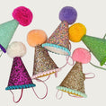 Load image into Gallery viewer, Colorful, glitter covered party hats with pom-poms at the tips.