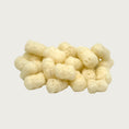 Load image into Gallery viewer, Close-up photo of a small pile of Wet Nose Pooch Puffs dog treats. They are ivory colored, about 1"-1.5" long, and similar in size to small tater tots. They look airy, like Cheetos puffy cheese snacks.